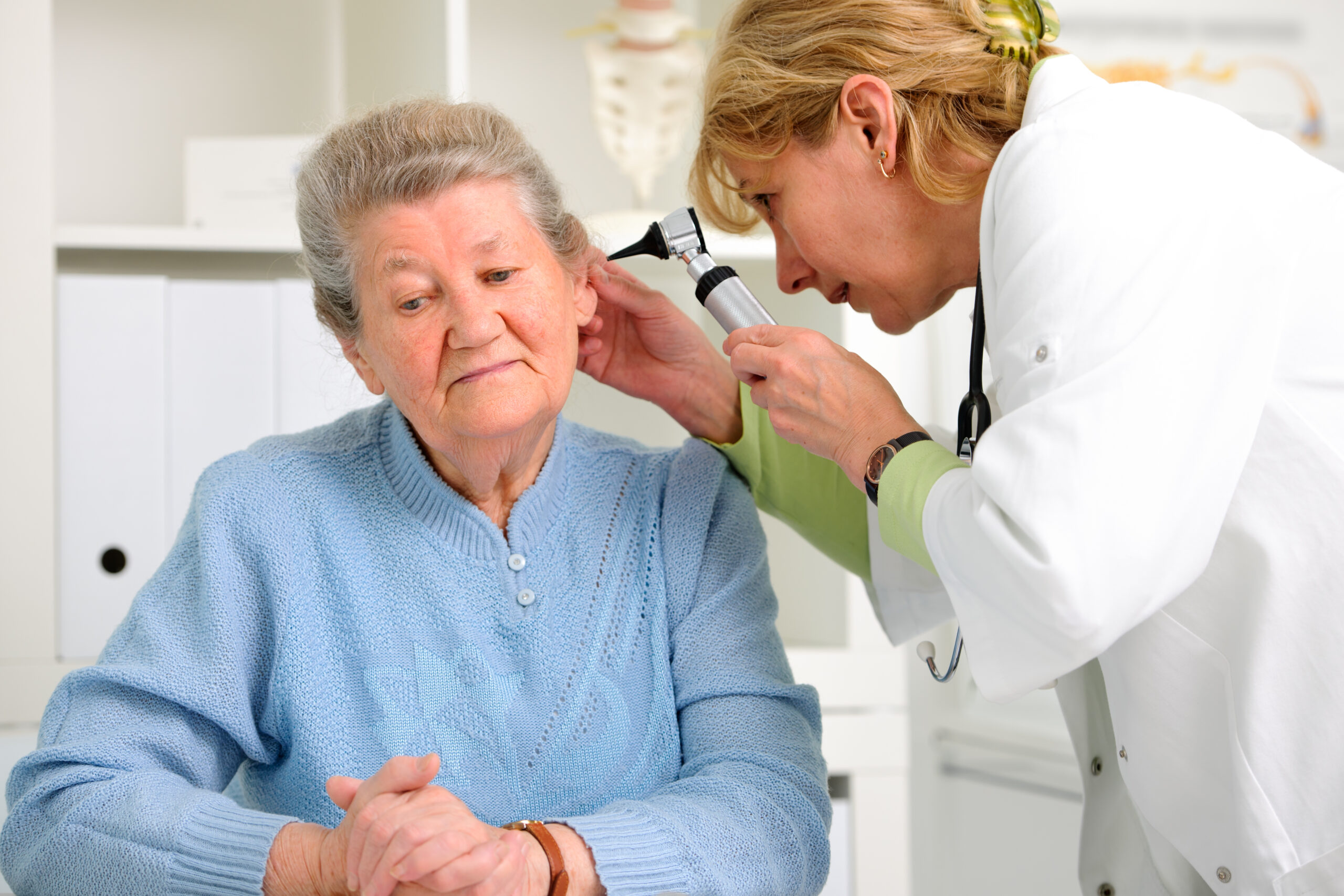 Doctor,Examining,Senior,Patient’s,Ears
